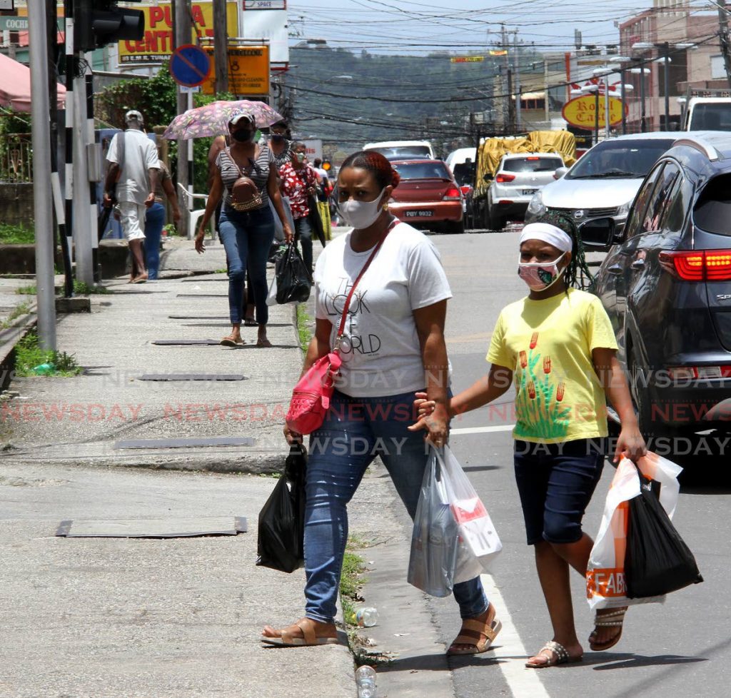 Busy sidewalks with shoppers in Tunapuna on Tuesday. - Angelo Marcelle