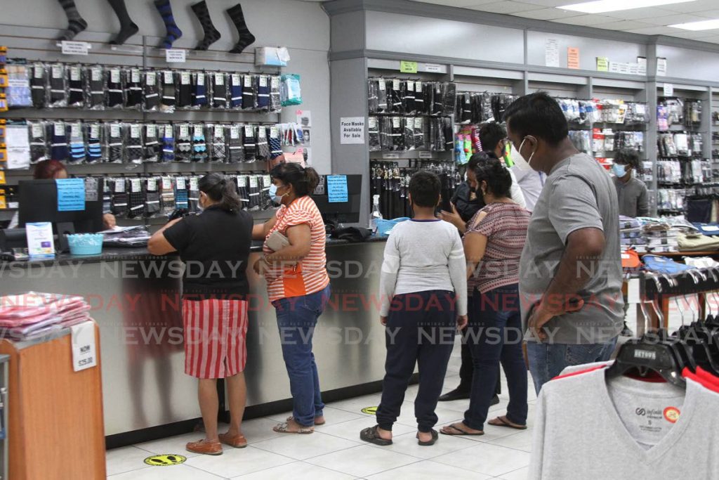 Shoppers browse a store in Princes Town on Tuesday. - Photo by Marvin Hamilton