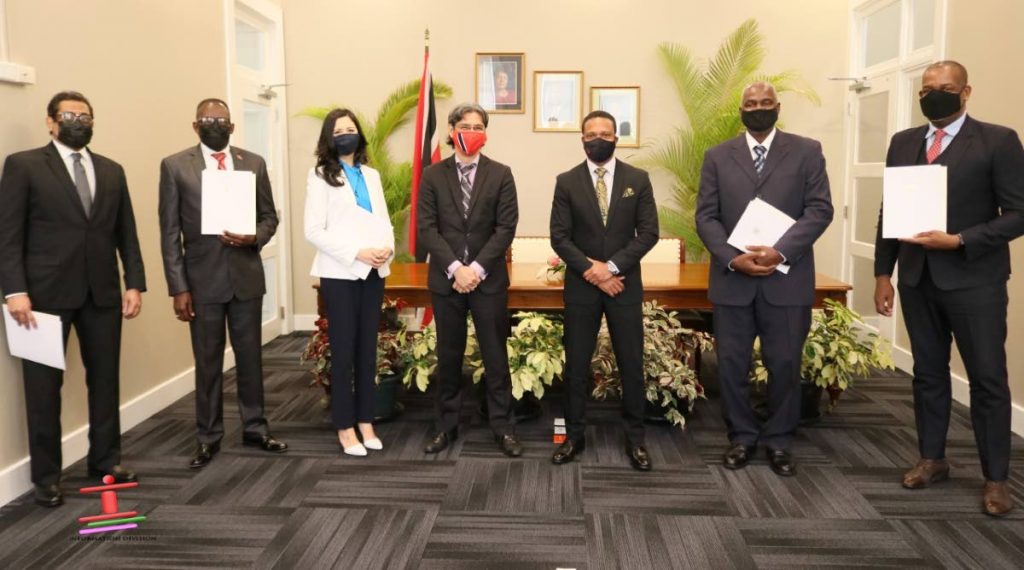New diplomats pose with Minister of Foreign and Caricom Affairs Dr Amery Browne. 
Vishnu Dhanpaul (from left), Edmund Dillon, Analisa Low, Bruce Lai (acting permanent secretary), 
Browne, Gerald Greene, and Dr Lovell Francis. 