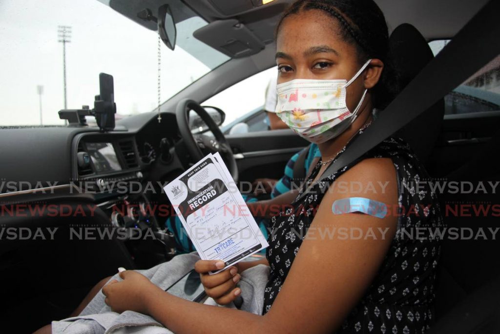 Sarai Grace Oliver, 17, got her first dose of the Pfizer vaccine at the Proman vaccination site, Ato Boldon stadium, Couva on August 18. - Photo by Lincoln Holder