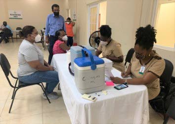 Rural development and local government minister Kazim Hosein observes the vaccination drive at the the L’Anse Noire Community Centre in Sangre Grande  - Photo courtesy Ministry of rural development and local government 