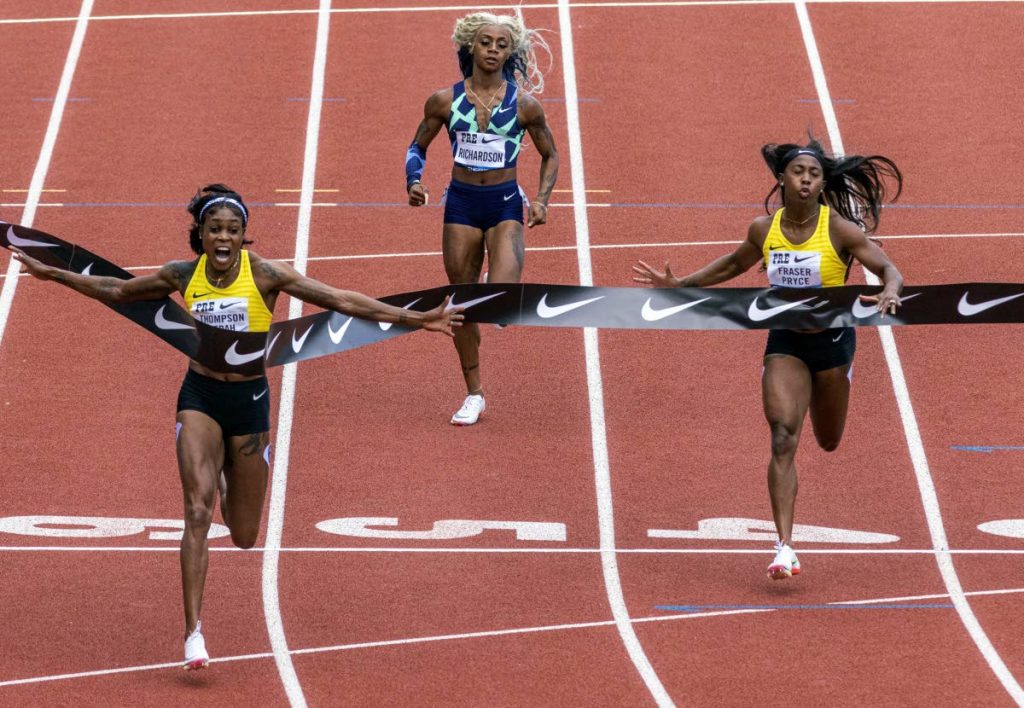 Jamaica's Elaine Thompson-Herah (left), wins the 100 metres, ahead of countrywoman Shelly-Ann Fraser-Pryce (right) who finished second, while American track and field sprinter Sha'carri Richardson (centre) finished last, on Saturday, at the Prefontaine Classic track and field meet in Eugene, Oregon, US. (AP PHOTO) - 