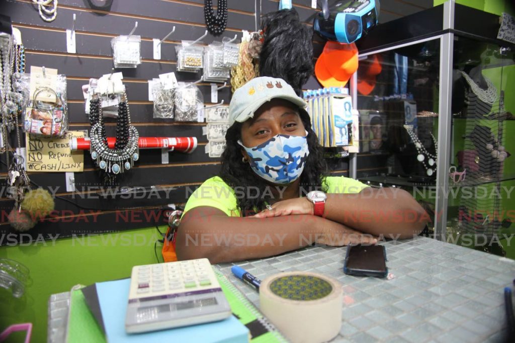 Clothing store owner Brookly-ann Telemaque speak about sales at her Couva store.  Photo by Lincoln Holder