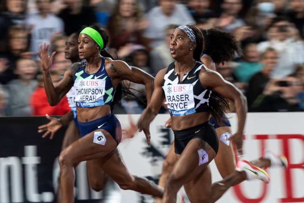 Shelly-Ann Fraser-Pryce of Jamaica, right, and Elaine Thompson-Herah of Jamaica compete in the women's 100 metres race at the Athletissima IAAF Diamond League international athletics meeting at the Stade Olympique de la Pontaise in Lausanne, Switzerland, on Thursday. - AP Photo