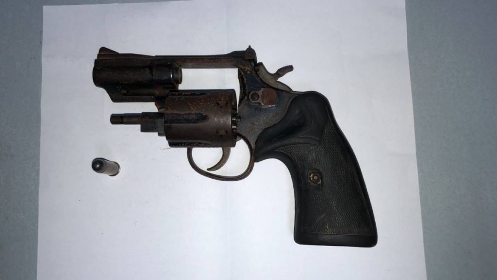 A .38 revolver and a bullet were seized at the Aranguez Savannah on Thursday night. 

PHOTO COURTESY TTPS - PHOTO COURTESY TTPS