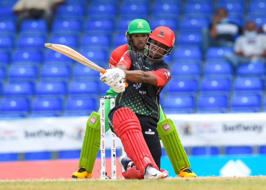  Evin Lewis (R) of Saint Kitts & Nevis Patriots hits a six as Nicholas Pooran (L) of Guyana Amazon Warriors watches during the 2021 Hero Caribbean Premier League match 5 at Warner Park Sporting Complex onSaturday, in Basseterre, St Kitts. - via CPL T20