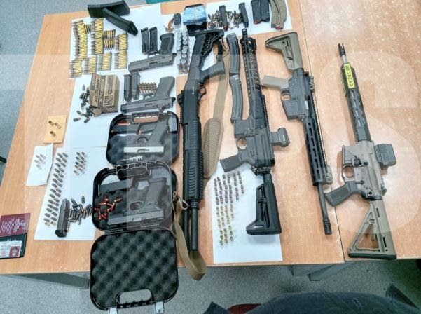 A cache of weapons and ammunition seized by police from a firearm user’s licence (FUL) holder on Saturday. - TTPS