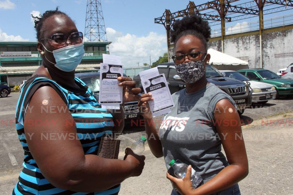Lisa Andrews and her daughter Shael David got their covid19 vaccines at the South West Regional Indoor Sport Arena in Point Fortin on Monday. - Lincoln Holder