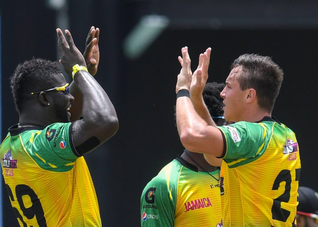Jamaica Tallawahs' Kennar Lewis (left) and Migael Pretorius celebrate the dismissal of Roston Chase of St Lucia Kings during the 2021 Hero Caribbean Premier League match 3 between Jamaica Tallawahs and Saint Lucia Kings at Warner Park Sporting Complex on Friday in Basseterre, St Kitts. (Photo by CPL T20/Getty Images) - 