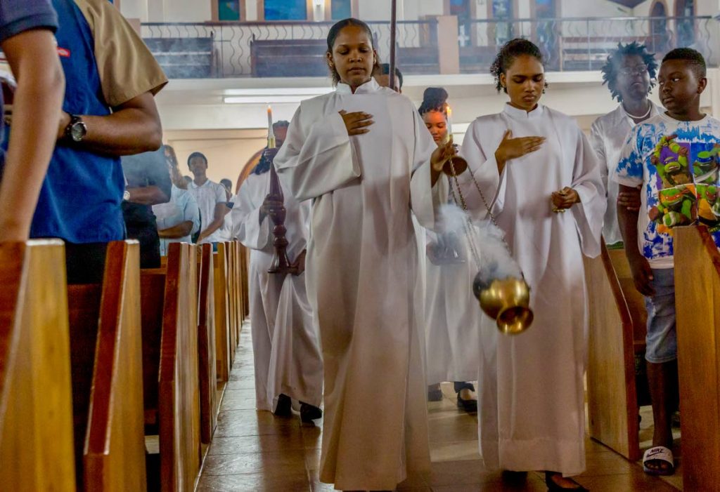 FILE PHOTO: An acolyte swings the thurible during procession at Holy Thursday mass at St Joseph RC church in Scarborough.  - 