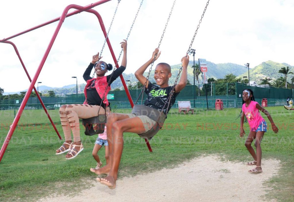 Kids enjoying the swings during the Christmas treat held at the Nelson Mandela Kids Play Park in St Clair in 2019. FILE PHOTO