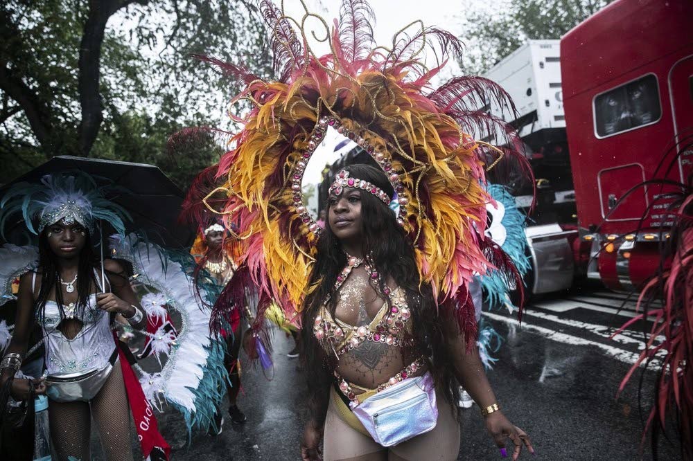 FILE PHOTO: Revellers participate IN the West Indian American Day Parade in the Brooklyn borough of New York, on September 2, 2019. - AP Photos