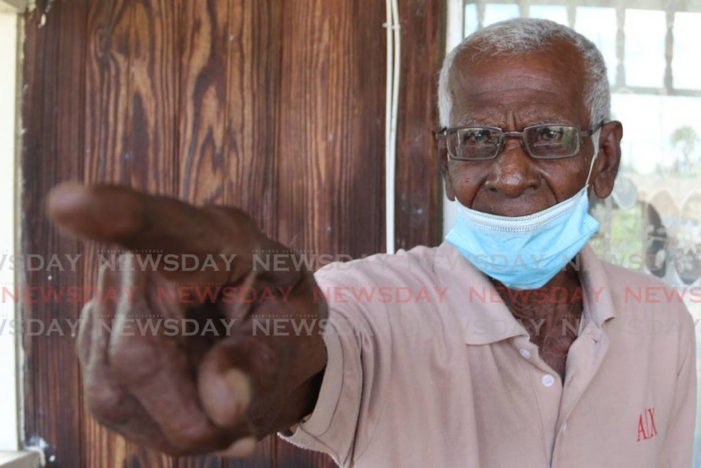In this January 30, 2021 file photo Ramhit Narine, 77, appeals to the authories for help to fix landslips to protect his home. Some elderly homeowners face challenges to comply with property tax guidelines. - Photo by Marvin Hamilton