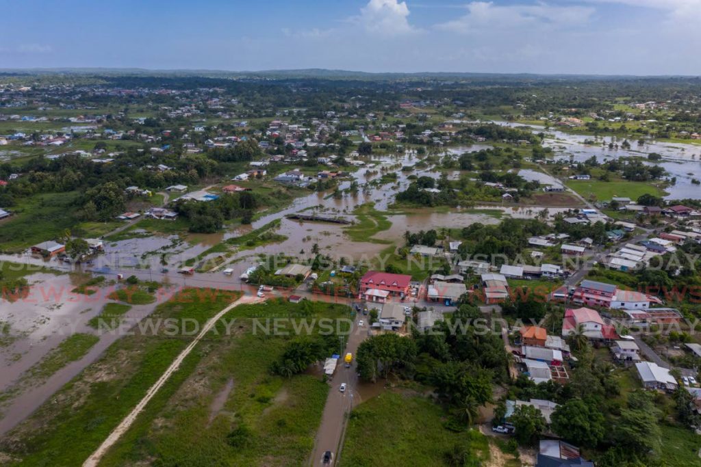 FILE PHOTO: Flooding on Suchit Trace, Penal, and surroundings on July 30. Climate change is believed to be a contributing factor to increased and more devastating flooding and rainfall around the world. - 