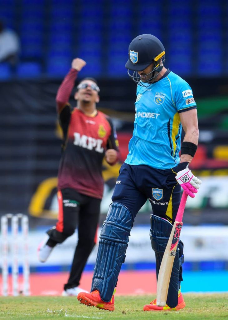  Faf Du Plessis (R) of Saint Lucia Kings walks off the field dismissed by Sunil Narine (L) of Trinbago Knight Riders during the 2021 Hero Caribbean Premier League match 9 at Warner Park Sporting Complex on Tuesday. - via CPL T20