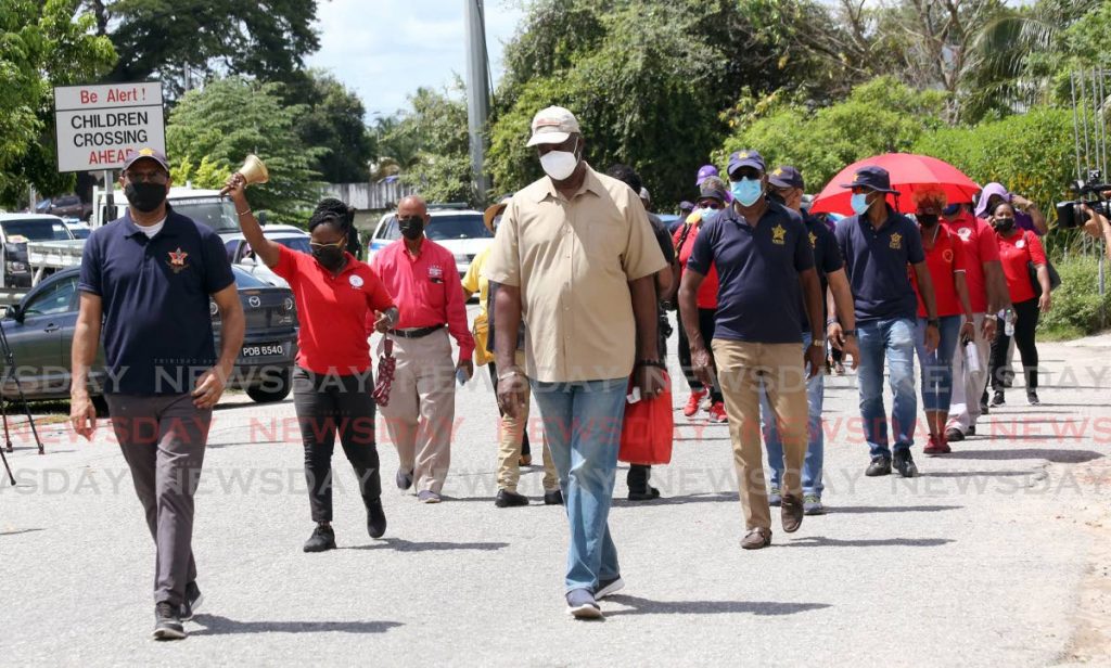 The Trade Unions leaders 'Freedom Day Walk ' from Aranquez Savannah to Woodford Square in Port of Spain. - Photo by Sureash Cholai