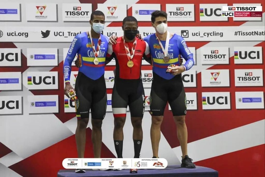 TT's Nicholas Paul, centre, celebrates atop the podium after receiving his men's keirin gold medal at the UCI Nations Cup in Cali, Colombia on Saturday. At left is silver medallist Kevin Quintero and right, bronze medallist Santiago Ramirez, both of Colombia.  - UCI