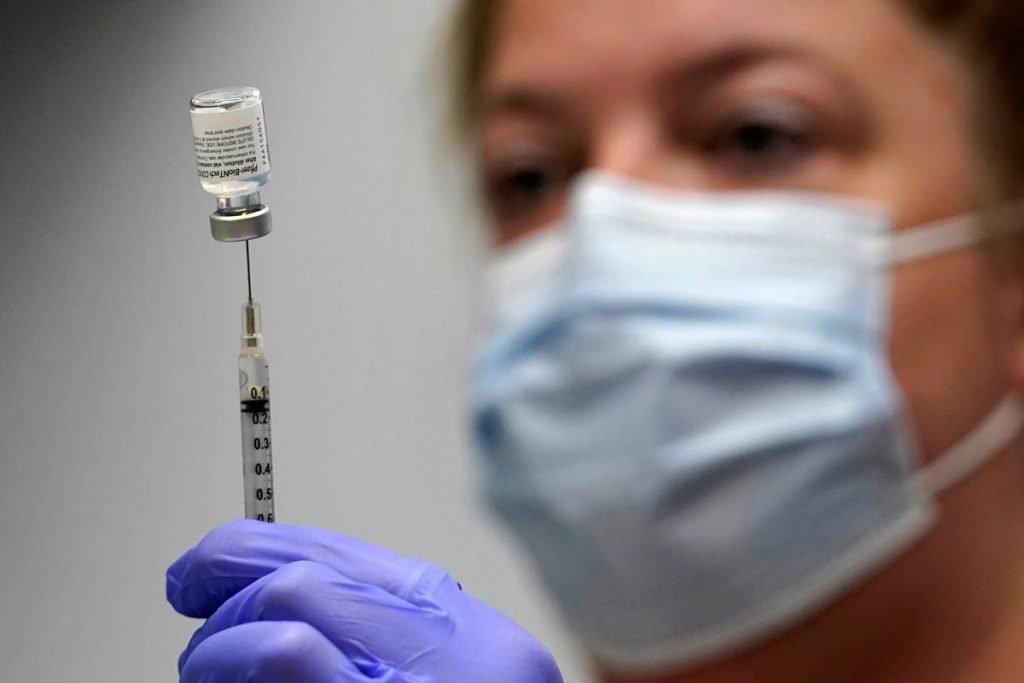The Pfizer covid19 vaccine loaded into a syringe by a pharmacy technician. AP PHOTO 