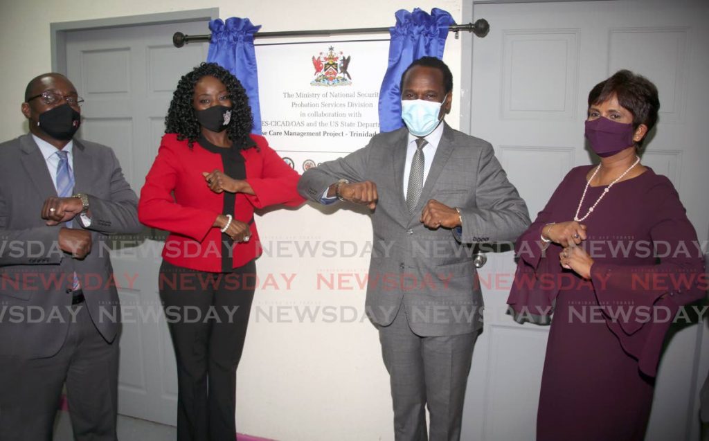 ELBOWED: From left, US Charge d'Affairs Shante Moore, Minister of Social Development and Family Services Donna Cox, National Security Minister Fitzgerald Hinds and Chief Probation Officer Sintra Maharaj, elbow 