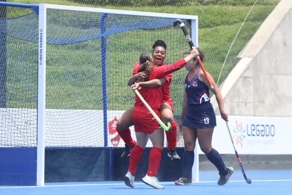 Trinidad and Tobago hockey players celebrate scoring against Paraguay in the Pan Am Challenge in Lima, Peru on Tuesday.