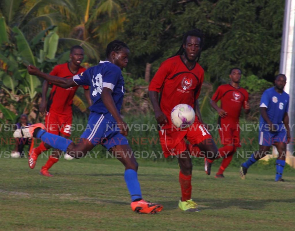 In this December 28, 2019 file photo, Bethel United (blue) take on Matura United during a TT Super League match. - Roger Jacob