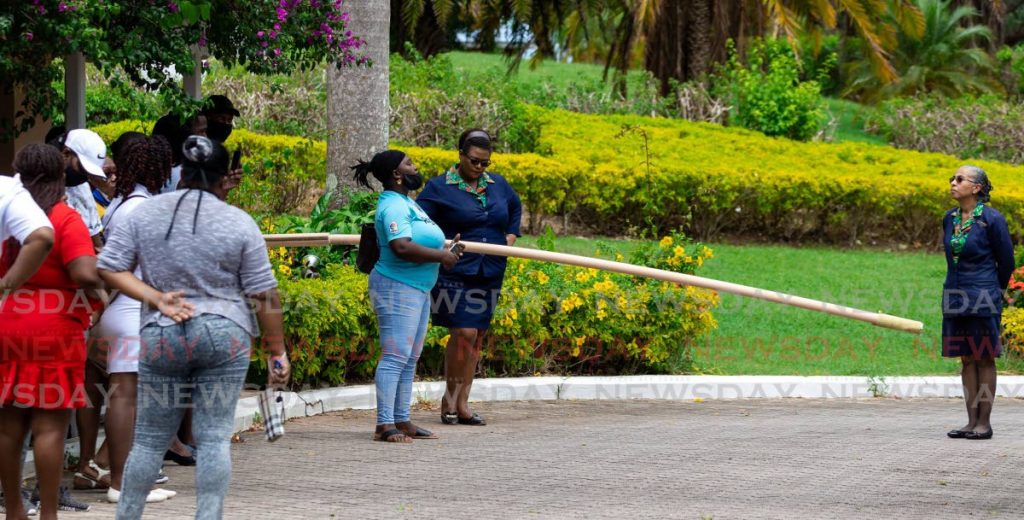 In this 2020 file photo Coco Reef Resort and Spa manager Rachel-Anne Mc Sween, right, and disgruntled workers discuss their employment status following of the national lockdown and border closure. In industrial relations, consultation, discussion and agreement can mean different things to different parties. - PHOTO BY DAVID REID