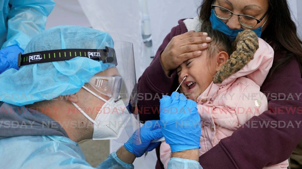 A child gets a covid19 test. AP Photo - 