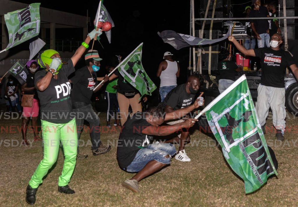 FILE PHOTO: PDP supporters wave flags at a political meeting at Signal Hill Recreation Ground earlier this year. - 