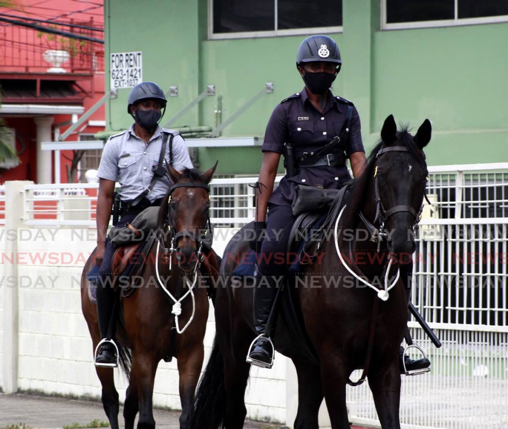 In this file photo, two members of the Mounted Branch of the TTPS conducted their morning patrol in the Woodbrook community. Finance minister Colm Imbert  in his 2021/2022 budget allocation said  $5.664 billion would be allocated to national security.- Photo by Roger Jacob