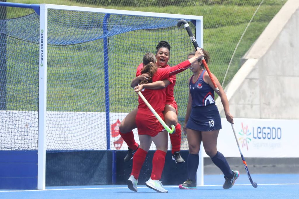 Trinidad and Tobago hockey players celebrate scoring against Paraguay in the Pan Am Challenge in Lima, Peru on Tuesday. - Pan Am Hockey