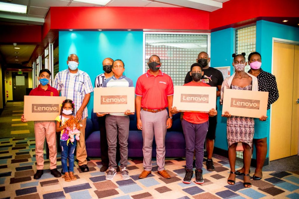 JEF inaugural scholarship winners and parents with JMMB CEO Elson James at the first awards distribution.   - Photo courtesy JMMB Express