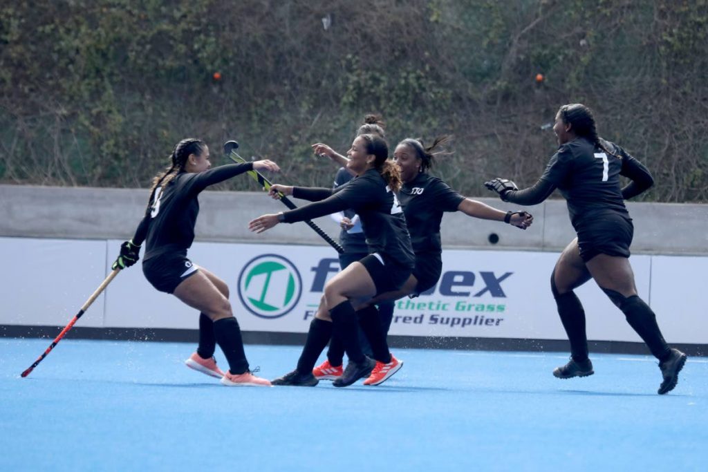 Members of the TT women hockey team celebrate a goal during their Pan Am Challenge semi-final match against Paraguay in Lima, Peru on Friday. PHOTO COURTESY PAN AM HOCKEY. - 