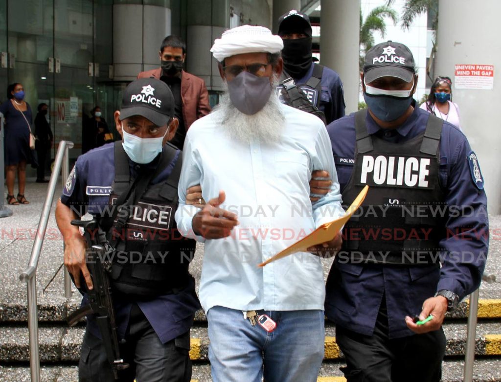 TAKEN AWAY: Activist Umar Abdullah is taken away by police during a protest outside the Ministry of Education on October 04. FILE PHOTO - 