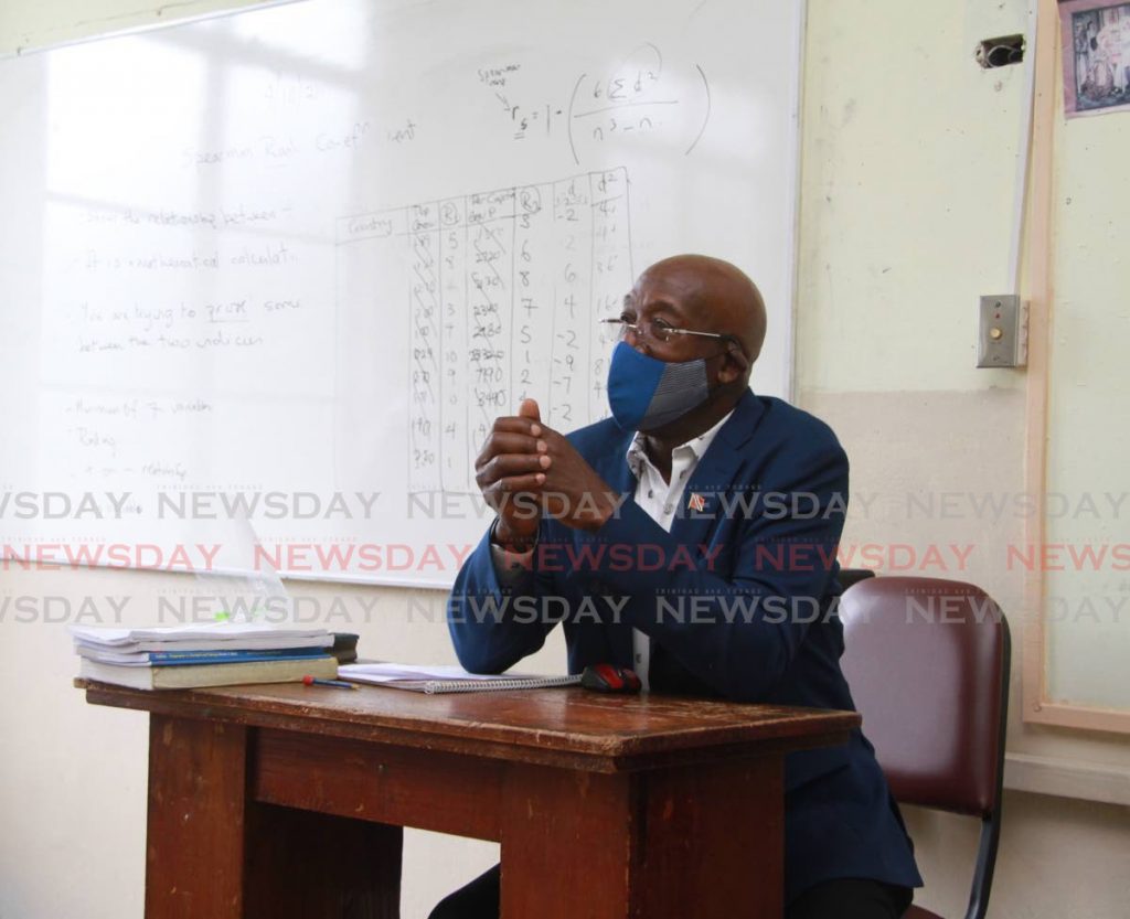 BACK TO SCHOO: Prime Minister Dr Keith Rowley sits in a classroom at St Joseph's Convent in Port of Spain which he visited on Monday. PHOTO COURTESY OFFICE OFF THE PRIME MINISTER - 