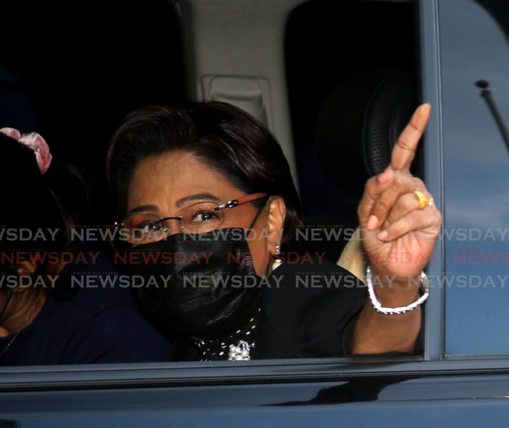 SEE YOU FRIDAY: Opposition Leader Kamla Persad-Bissessar who will give her response to the 2022 budget on Friday, gestures as she leaves the Red House after speaking with reporters on Monday evening. Photo by Sureash Cholai - 
