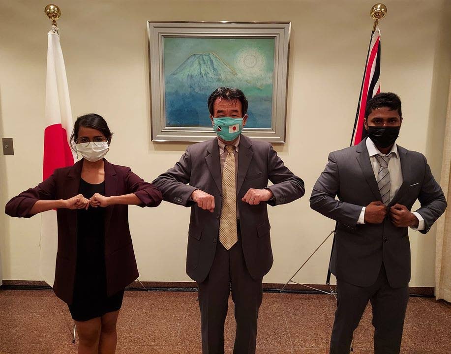 Ambassador Hirayama (centre) pose swith the MEXT Scholarship recipients Anastasia Ramjag and Avinash Boodoo. - Photo courtesy Japanese Embassy 