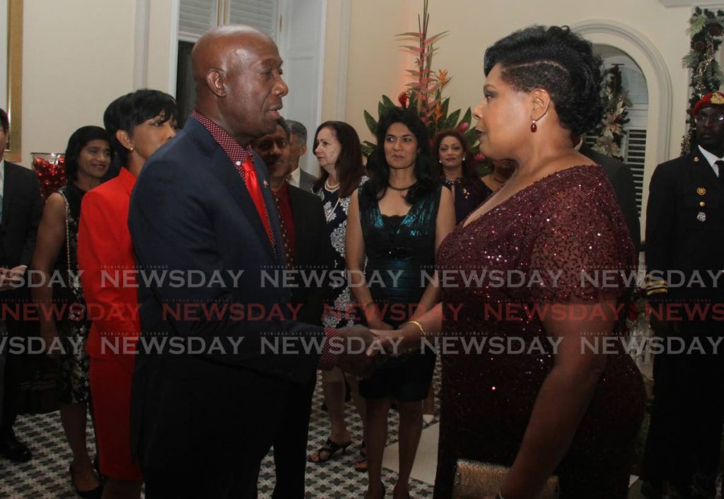 In this December 17, 2019 file photo, President Paula-Mae Weekes greets Prime Minister Dr Keith Rowley during a reception at President's House, St Ann's. - File Photo
