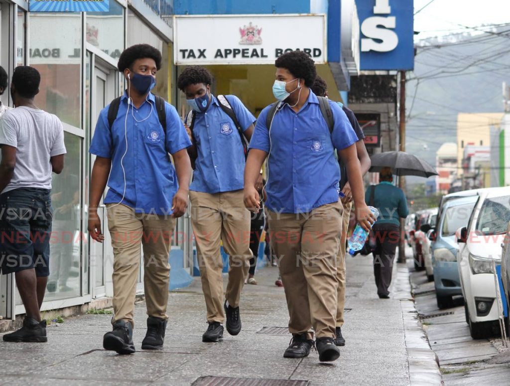 In this file photo, form four students from Queen's Royal College head home after face-to-face classes in Port of Spain. Photo by Roger Jacob - 