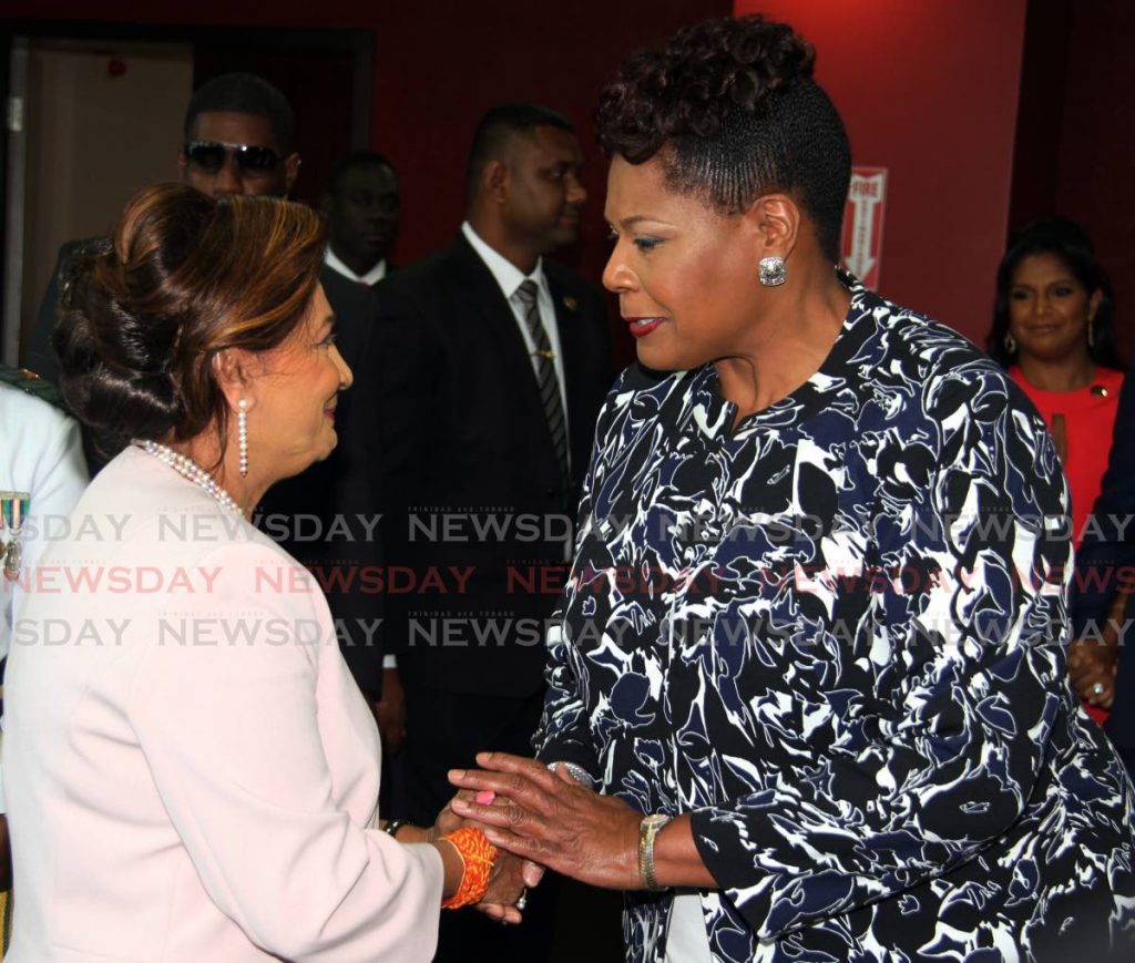 Opposition Leader Kamla Persad-Bissessar, seen here in 2018 with President Paula-Mae Weekes, has filed a motion with Parliament calling for a tribunal  to investigate Weekes' conduct in the appointment of a police commissioner. File photo - 