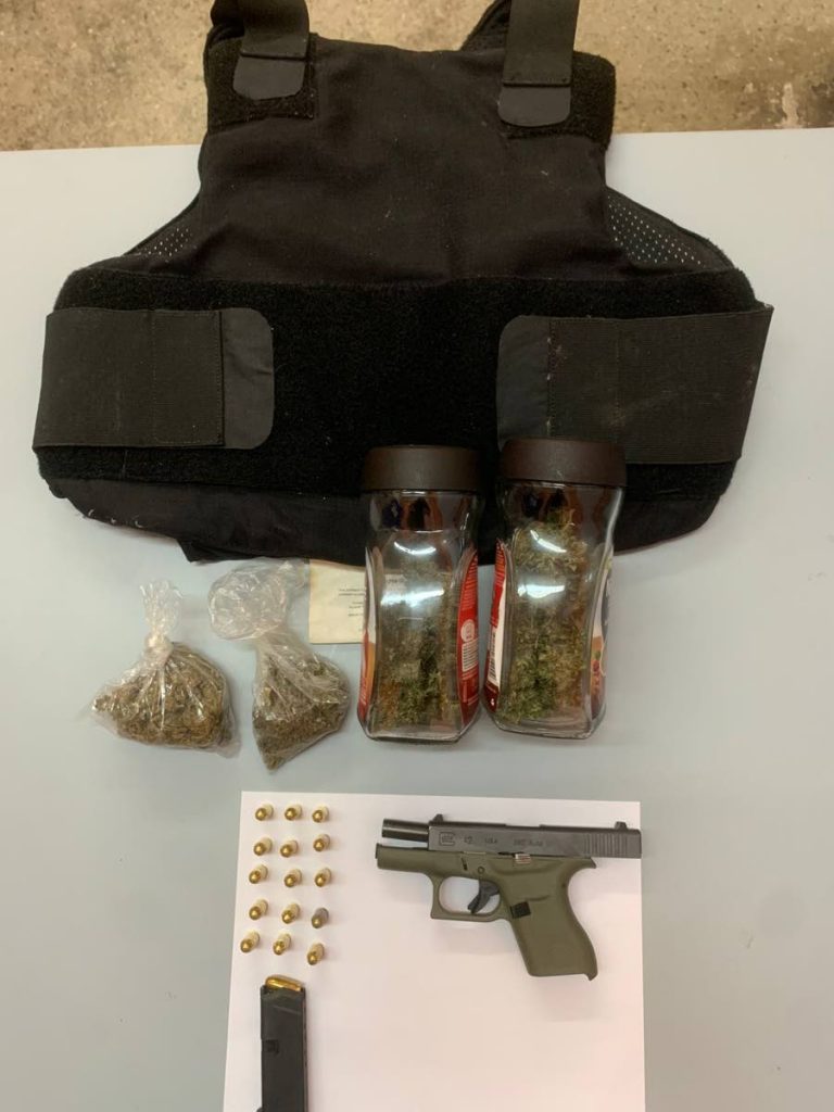 The bulletproof vest, firearm, ammunition and marijuana found at a house in El Dorado. - Courtesy TTPS