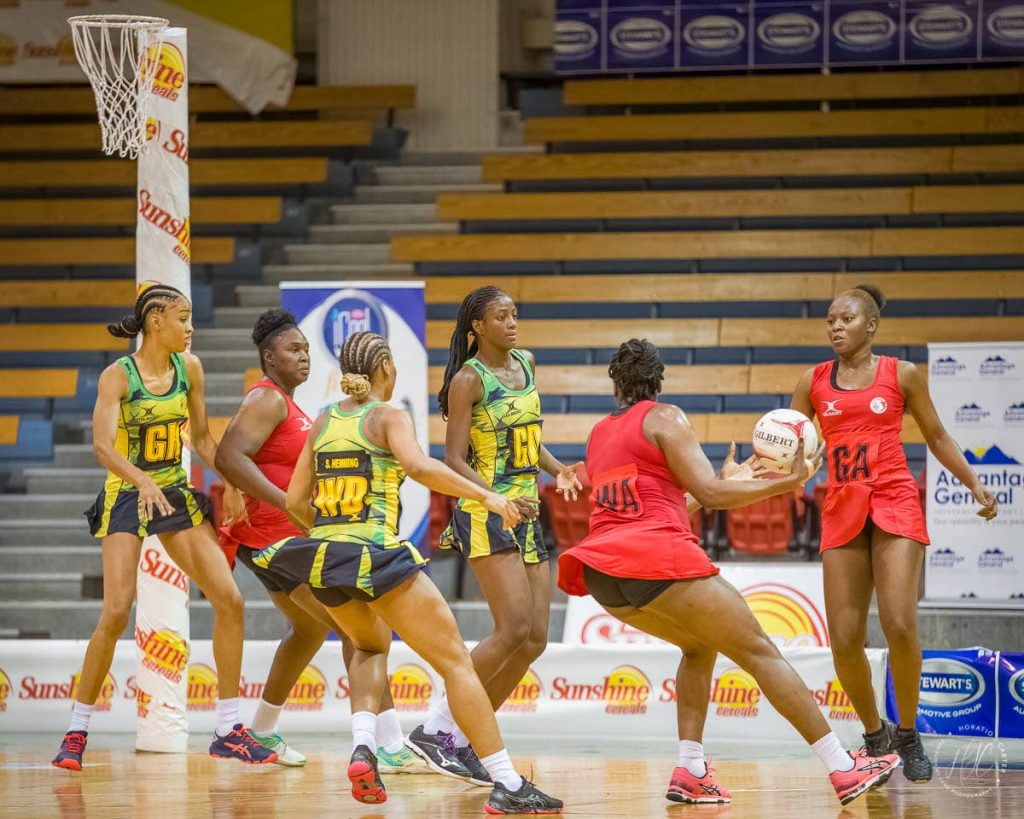 Trinidad and Tobago women's netballers (in red) lost 73-22 in the third and final game of the Magaret Beckford netball series, in Kingston, Jamaica. - 