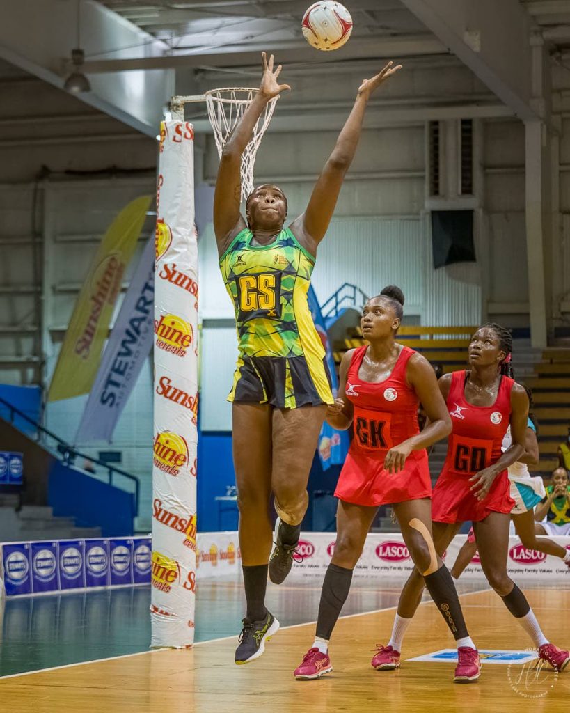 In this photo taken on October 16, Jamaica's goal-shoot jumps for a loose ball against Trinidad and Tobago in Game 1 of the Magaret Beckford Sunshine series in Kingston, Jamaica. TT lost their second match against Jamaica, on Tuesday night 64-32. - via Jamaica Netball