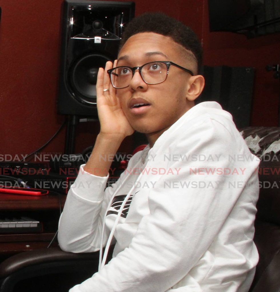  Aaron Duncan discusses his work as a producer at his music studio, Morne Coco Road, Petit Valley.  - PHOTO BY ANGELO MARCELLE