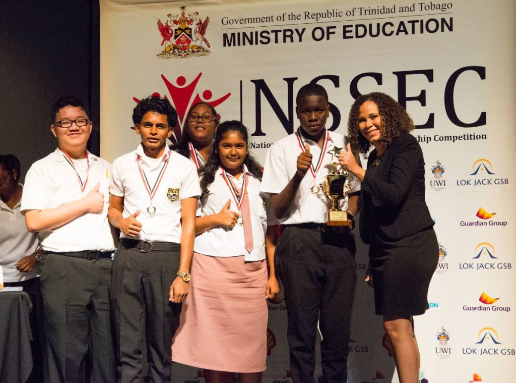 WITH YOUTH IN MIND: Guardian Group's head of Branding and Communications Ayesha Boucaud-Claxton, right, with some of the  participants of the 2018 National Secondary Schools Entrepreneurship competition. The Group, for the fourth year running, is sponsoring the 2021 edition of the competition. PHOTO COURTESY GUARDIAN GROUP  - The Guardian Group