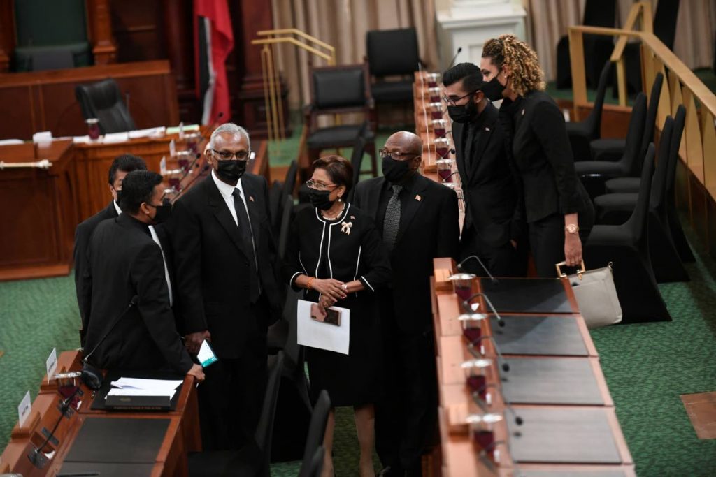 Opposition Leader Kamla Persad-Bissessar and opposition MPs caucus after the extraordinary sitting of the House on her motion to impeach the President. The motion failed by 47-24 votes. - Photo: Parliament Pool Photographer