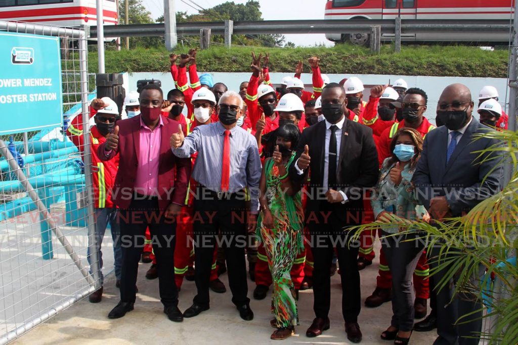 Public Utilities Minister Marvin Gonzales and St Joseph MP Terrence Deyalsingh cut the ribbon to formally commission the booster station at Eastern Main Road, Champ Fleurs on Thursday. - ROGER JACOB