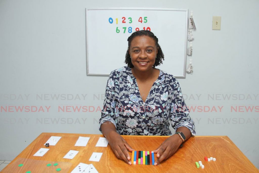 Educational therapist Toni Blackett-Felix lays out blocks to work with children at her office, Cocrico Street, off Orange Grove Road, Tacarigua. - PHOTO BY AYANNA KINSALE