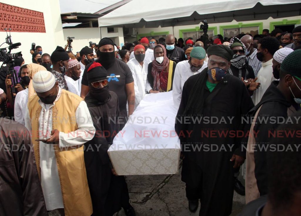 Pallbearers carry the casket of the former leader of the Jamaat Al Muslimeen Yasin Abu Bakr during his funeral at the muslimeen's mosque on Mucurapo Road, Port of Spain, on Friday. - SUREASH CHOLAI