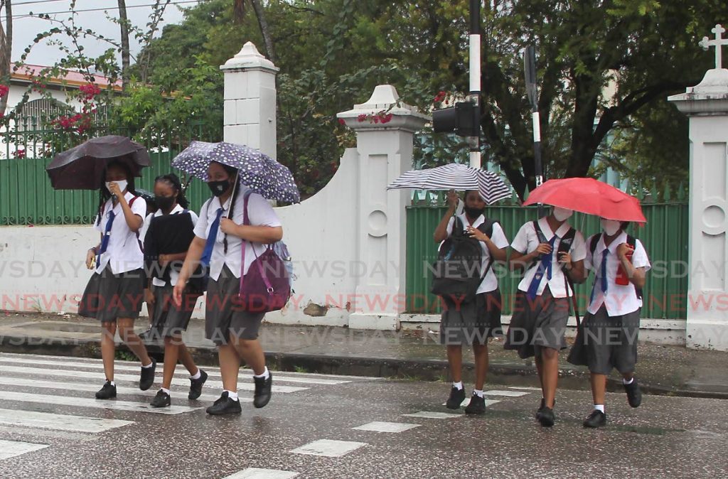 Students from Holy Name Convent Port of Spain, leave after the first day of face-to-face classes. - Photo by Roger Jacob
