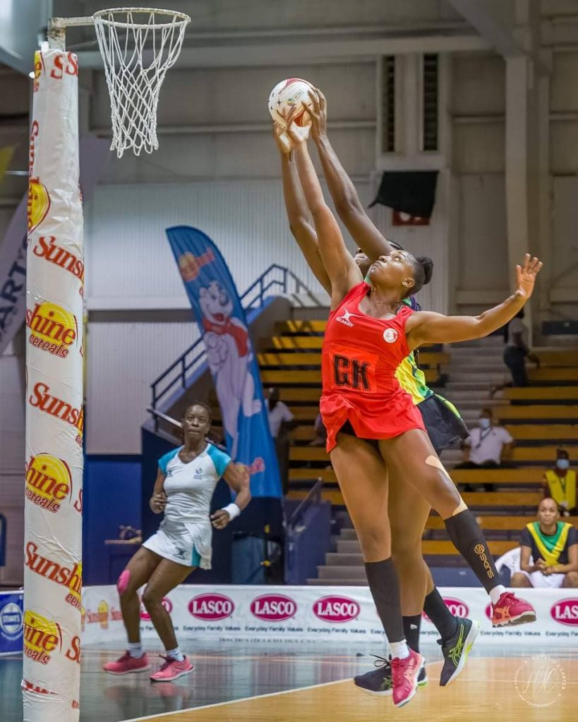 In this file photo, TT's goal keep Shaquanda Greene-Noel battles for the ball during a recent netball match against the Jamaica women's team.  